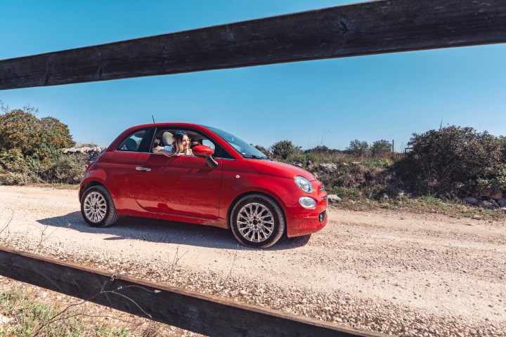 Red fiat 500 in countryside