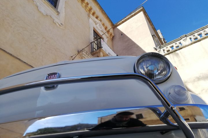 a motorcycle parked on the side of a building