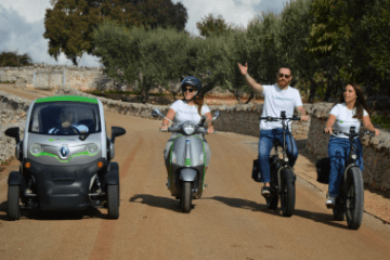 a group of people riding on the back of a motorcycle