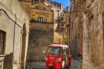 a stone building that has a narrow street