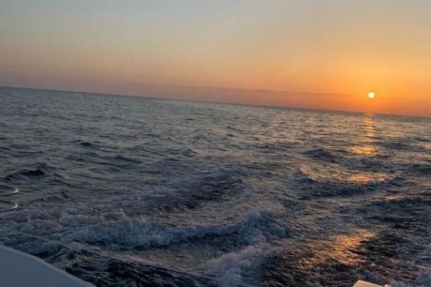 a sunset over a body of water