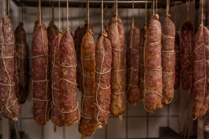 a bunch of bananas hanging from a wire