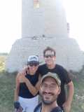 a man and a woman standing in front of a mountain in Puglia